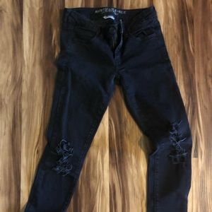 AMERICAN EAGLE SUPER STRETCH JEGGING RIPPED BLACK